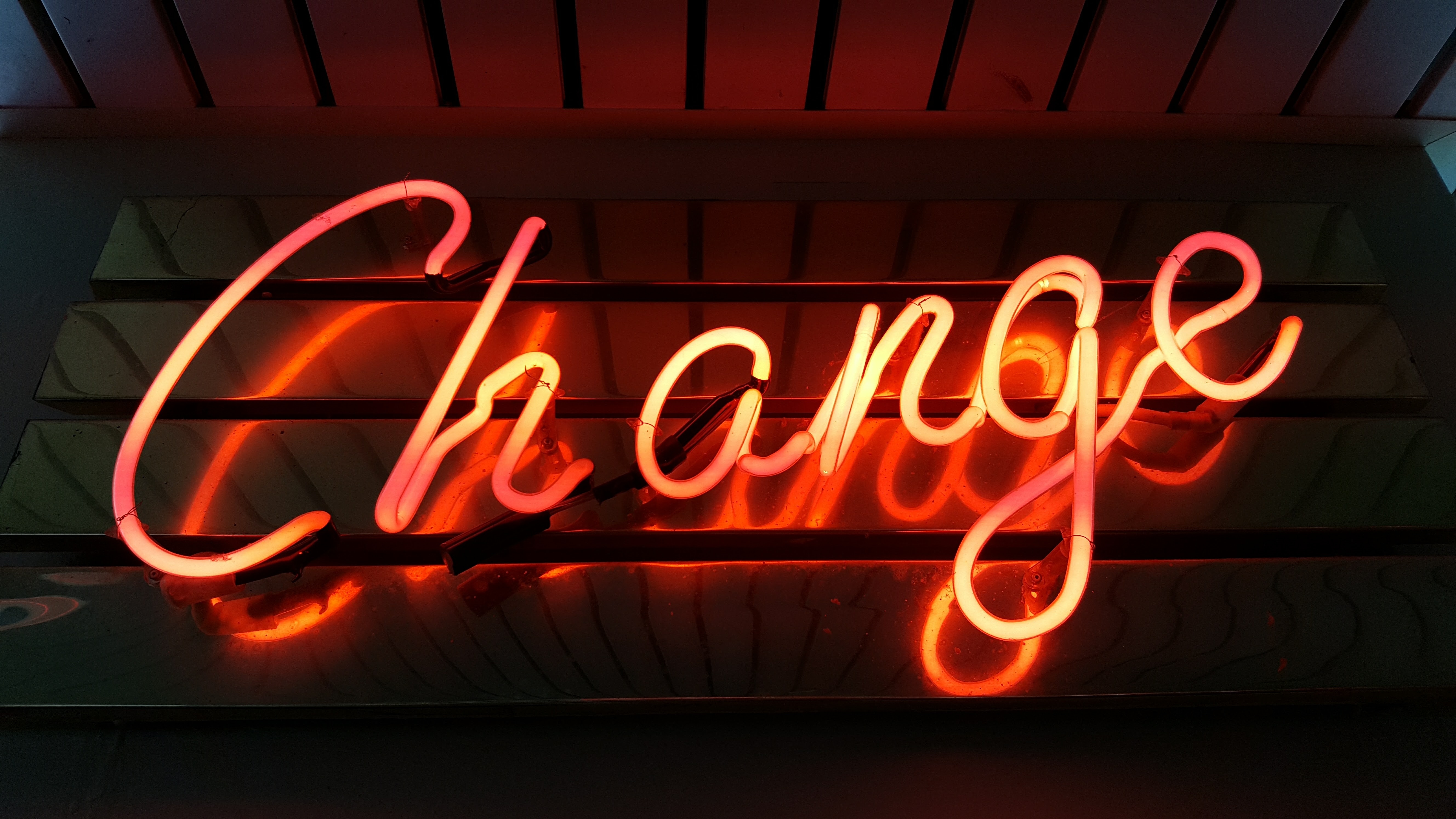 Neon sign says change